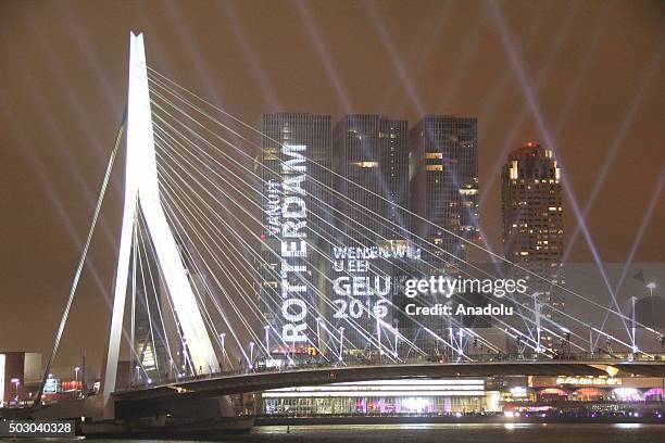 Fireworks and light shows illuminate the sky during New Year celebrations at Erasmusbrug in Rotterdam, Netherlands on January 01, 2016.