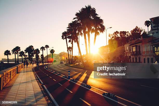 sunset beach drive - malaga fotografías e imágenes de stock