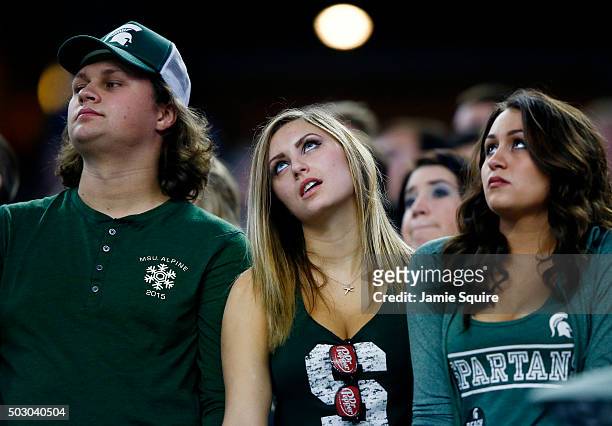 Michigan State Spartans fans react in the third quarter against the Alabama Crimson Tide during the Goodyear Cotton Bowl at AT&T Stadium on December...