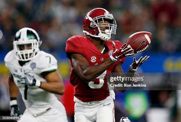 Calvin Ridley of the Alabama Crimson Tide completes a 50 yard touchdown pass in the third quarter against the Michigan State Spartans during the...