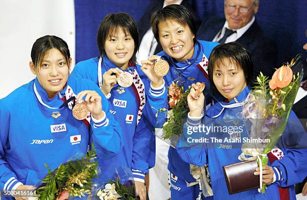 Bronze medalists Haruka Ueda, Norie Urabe, Ai Shibata and Maki Mita of Japan pose for photographs at the medal ceremony for the Women's 200x4 relay...