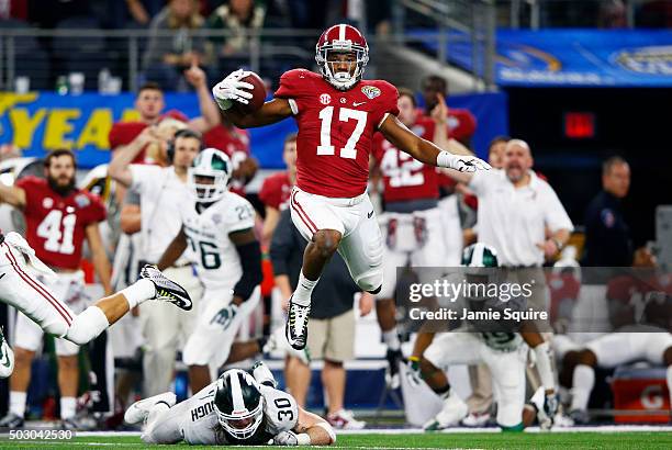 Running back Kenyan Drake of the Alabama Crimson Tide runs for 58-yards in the fourth quarter against the Michigan State Spartans during the Goodyear...