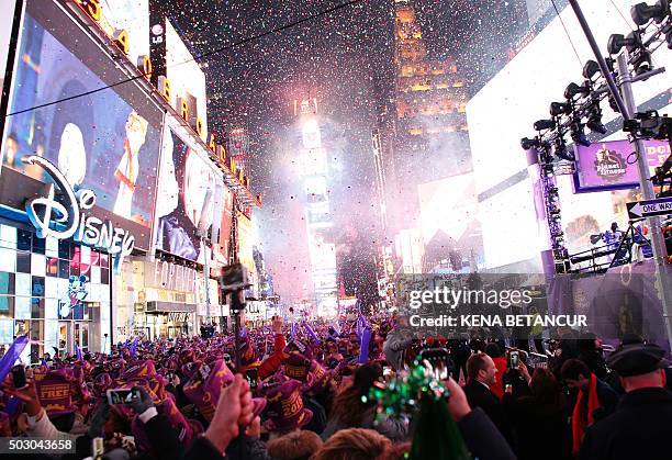 Revelers celebrate after the ball drop during New Year's Eve celebrations in Times Square on January 1, 2016 in New York. AFP PHOTO/ KENA BETANCUR /...
