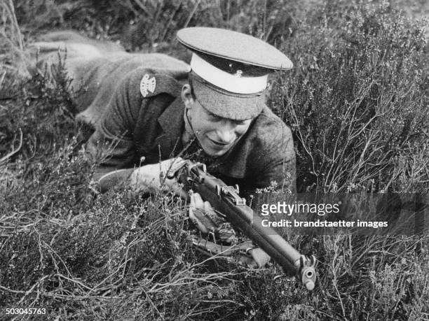 George Lascelles - a nephew of the King of England - during a military exercise of Eton Collgge Officers Training Corps. Pirbright. 11th March 1938....