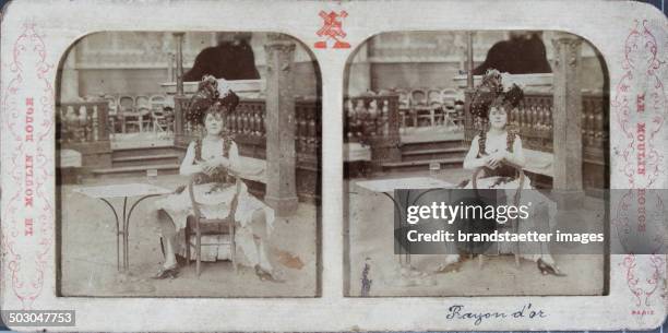 Le Moulin Rouge Paris. Rayon d'or [Can-Can dancer sitting]. About 1880; hand-colored.; semi-transparent stereo photograph .