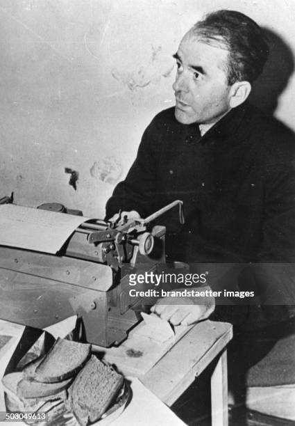 German Nazi architect Albert Speer photographed in his cell at Nuremberg; Germany - during the Nuremberg trials. Speer was photographed working at a...