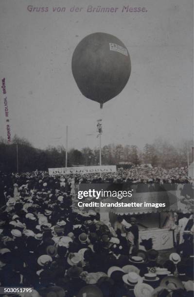 Brno. Look at the numerous spectators on the Brno Exhibition. In the background a balloon. May 1907. Photograph.