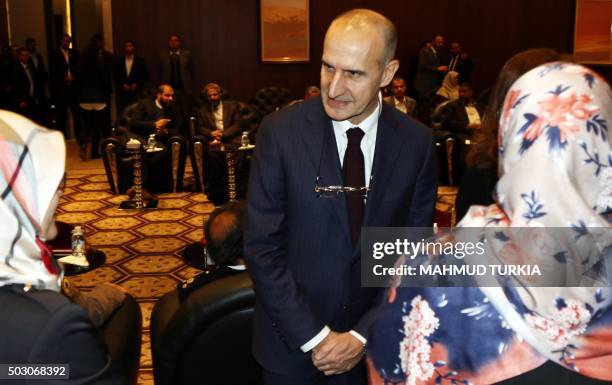 Italian Major General Paolo Serra speaks with members of Libya's General National Congress at the National Conference Hall in the Libyan capital,...