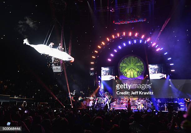 Trixie Garcia and Bernie Cahill ride a joint during the Dead and Company performance at The Forum on December 31, 2015 in Inglewood, California.