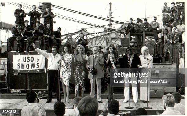 Performers Vic Damone, Brooke Shields, Cathy Lee Crosby, Bob Hope, Miss USA, George Kirby and Ann Jillian entertaining US troops at Christmas time...