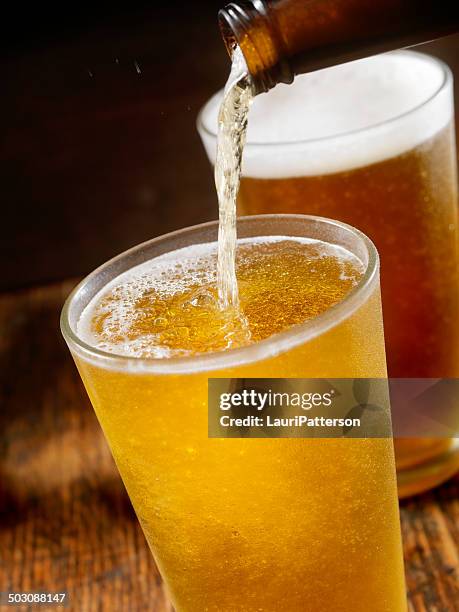 pouring beer - glasses condensation stock pictures, royalty-free photos & images