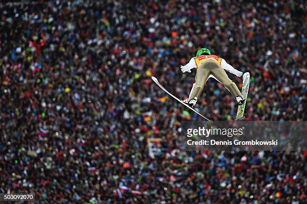 Peter Prevc of Slovenia soars through the air during his competition jump on Day 2 of the 64th Four Hills Tournament ski jumping event on January 1,...