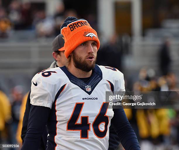 Long snapper Aaron Brewer of the Denver Broncos looks on from the field before a game against the Pittsburgh Steelers at Heinz Field on December 20,...