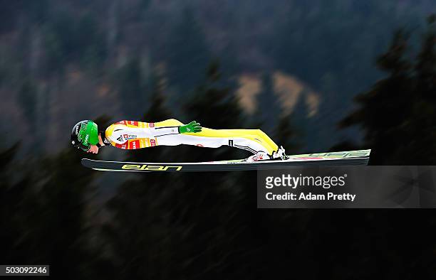 Peter Prevc of Slovenia soars through the air during his practice jump on Day 2 of the 64th Four Hills tounament on January 1, 2016 in...