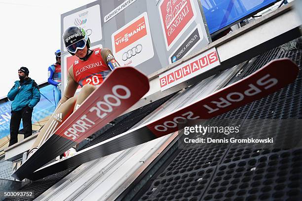 Anze Lanisek of Slovenia prepares for his trial jump on Day 2 of the 64th Four Hills Tournament ski jumping event on January 1, 2016 in...