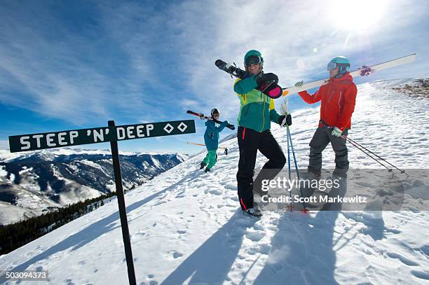 group of skiers hiking up mountainside in colorado - alta stock-fotos und bilder