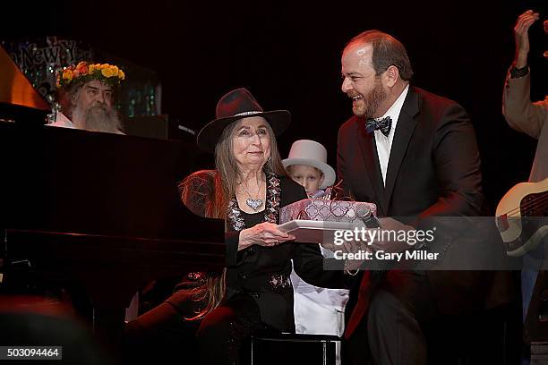 Bobbie Nelson is given a cake by Andy Langer as she celebrates her 85th birthday playing with her brother Willie Nelson at ACL Live on December 31,...