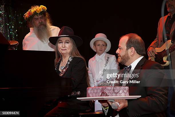 Bobbie Nelson is given a cake by Andy Langer as she celebrates her 85th birthday playing with her brother Willie Nelson at ACL Live on December 31,...
