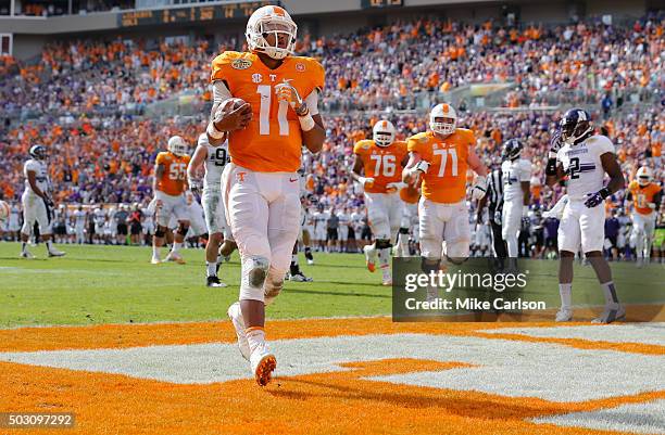 Joshua Dobbs of the Tennessee Volunteers scores a touchdown against the Northwestern Wildcats during the first half of the Outback Bowl at Raymond...