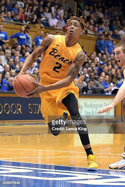 Nick Faust of the Long Beach State 49ers drives against the Duke Blue Devils at Cameron Indoor Stadium on December 30, 2015 in Durham, North...
