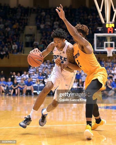 Brandon Ingram of the Duke Blue Devils drives against Nick Faust of the Long Beach State 49ers at Cameron Indoor Stadium on December 30, 2015 in...