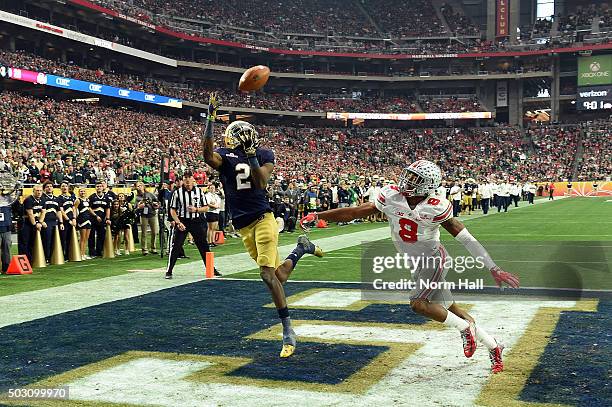 Wide receiver Chris Brown of the Notre Dame Fighting Irish hauls in a third quarter touchdown over cornerback Gareon Conley of the Ohio State...