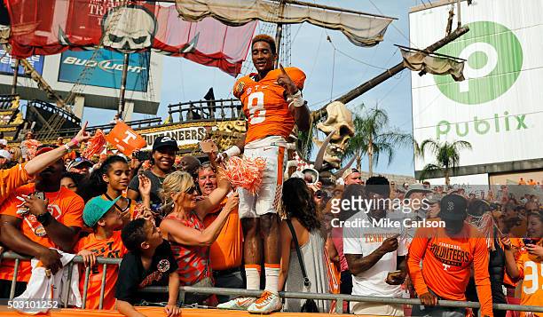 Justin Martin of the Tennessee Volunteers joins fans to celebrate a win over the Northwestern Wildcats in the Outback Bowl at Raymond James Stadium...