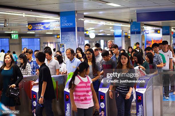 commuters leaving mrt station sukhumvit - sukhumvit mrt station stock pictures, royalty-free photos & images