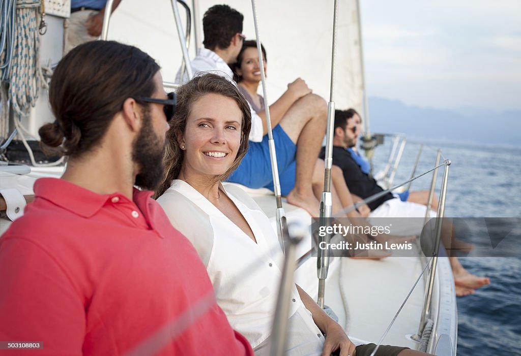 Friends relaxing on sailboat @sunset