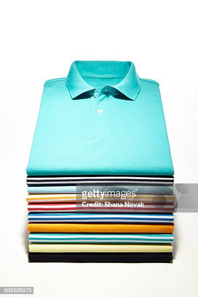 perfectly folded polo stack - closet shelf of colorful folded clothes stockfoto's en -beelden