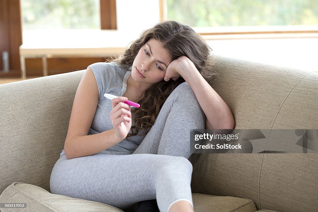 Young Woman with Pregnancy Test