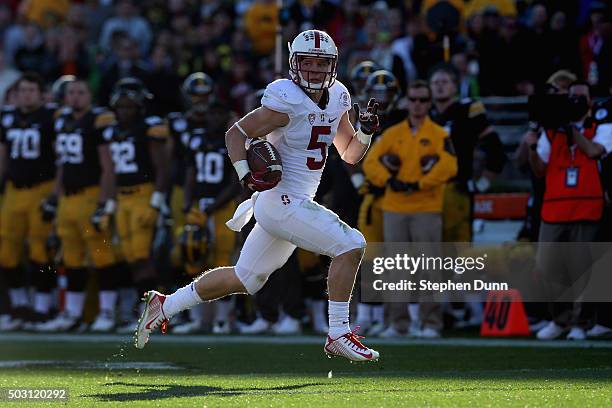 Christian McCaffrey of the Stanford Cardinal returns a punt 63 yards for a touchdown in the second quarter agains the Iowa Hawkeyes in the 102nd Rose...