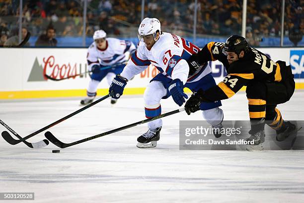 Max Pacioretty of the Montreal Canadiens battles with Adam McQuaid of the Boston Bruins during the 2016 Bridgestone NHL Classic at Gillette Stadium...