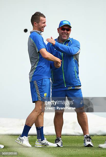 Peter Siddle of Australia and Australian coach Darren Lehmann look on during an Australian Nets Session on January 2, 2016 in Sydney, Australia.