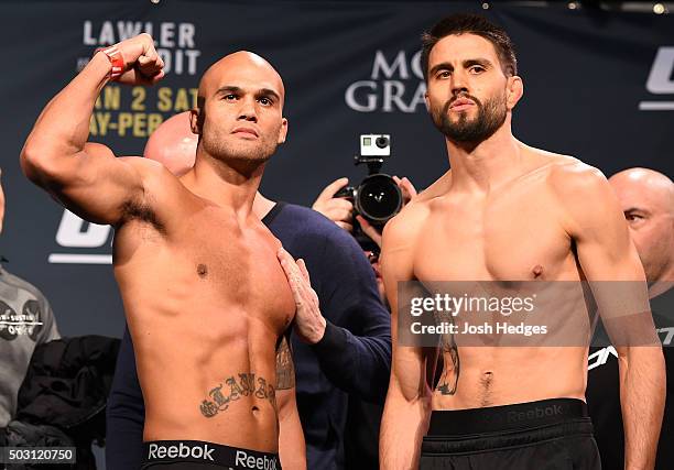 Welterweight champion Robbie Lawler and opponent Carlos Condit pose for photos during the UFC 195 weigh-in at the MGM Grand Conference Center on...