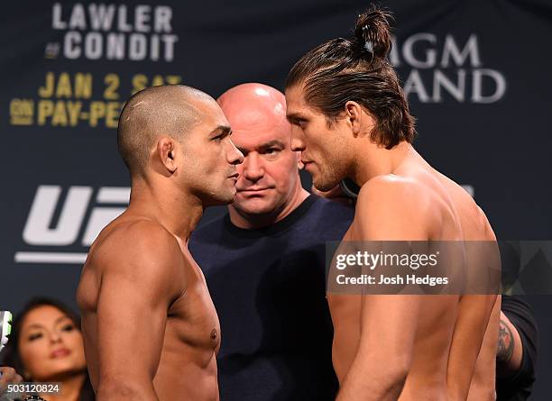 Opponents Diego Brandao of Brazil and Brian Ortega face off during the UFC 195 weigh-in at the MGM Grand Conference Center on January 1, 2016 in Las...