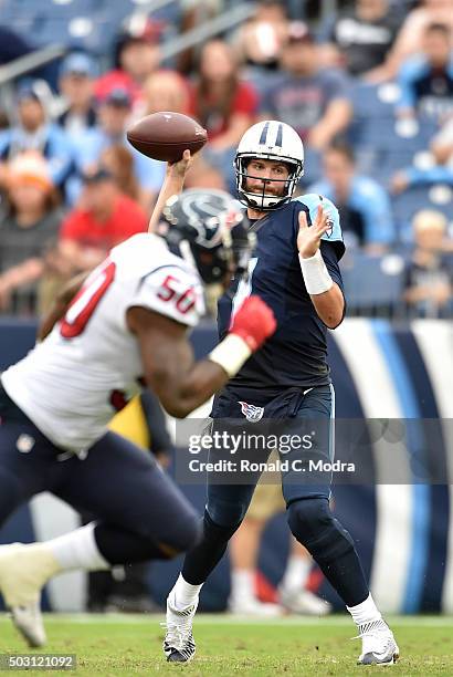 Quarterback Zach Mettenberger of the Tennessee Titans passes during a NFL game against the Houston Texans at Nissan Stadium on December 27, 2015 in...