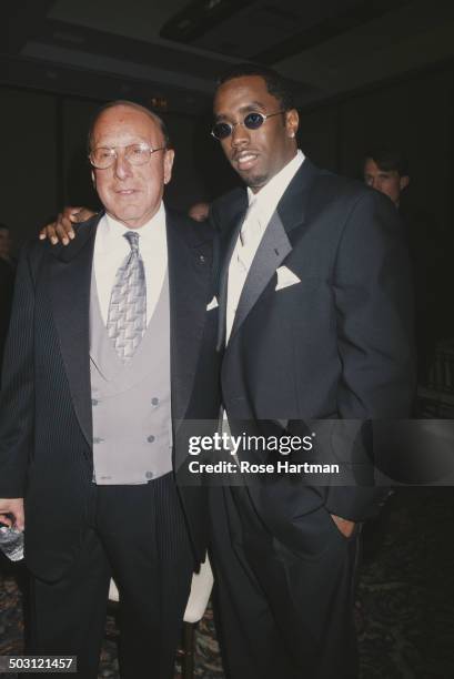 American rapper, record producer, and actor Sean Combs and American record producer and music industry executive Clive Davis attend a gala at the...