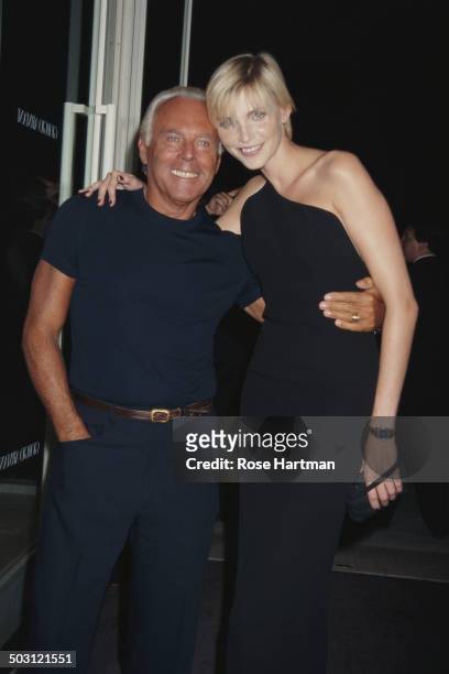 Italian fashion designer Giorgio Armani and German model and actress Nadja Auermann at a Giorgio Armani party being held at the 69th Regiment Armory,...