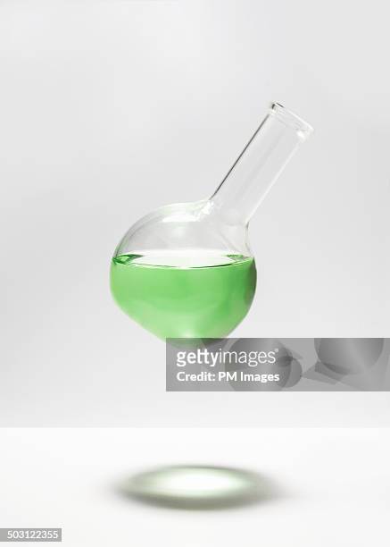 levitating chemistry glassware - pallone di vetro foto e immagini stock