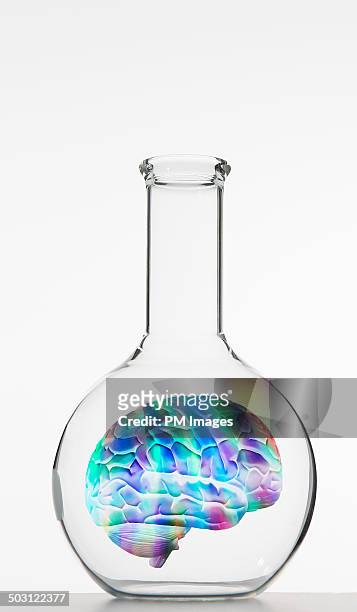 colorful brain in flask - scientific flask stock pictures, royalty-free photos & images