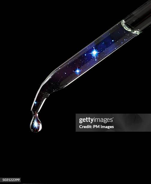 a drop of star light - eyedropper stock pictures, royalty-free photos & images