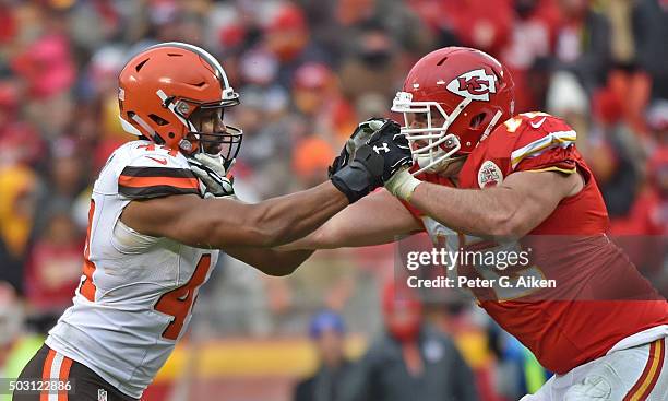 Linebacker Nate Orchard of the Cleveland Browns battles offensive tackle Eric Fisher of the Kansas City Chiefs during the first half on December 27,...