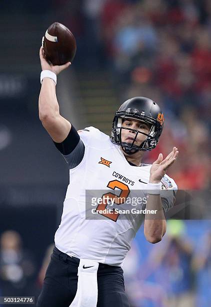 Quarterback Mason Rudolph of the Oklahoma State Cowboys passes against the Mississippi Rebels during the first quarter of the Allstate Sugar Bowl at...