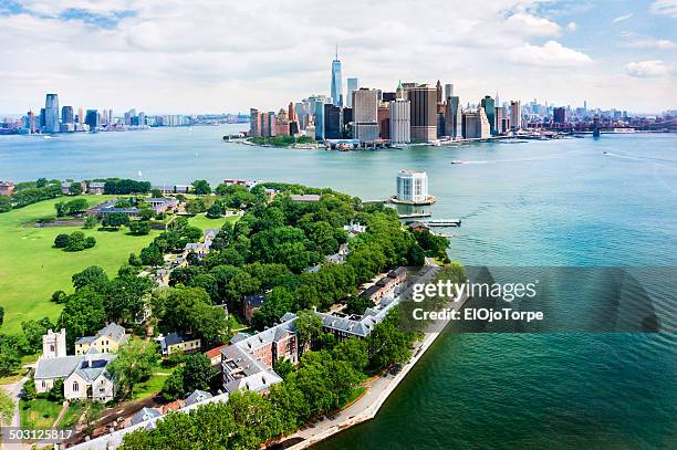 view of governors island and manhattan from air - governors island stock pictures, royalty-free photos & images