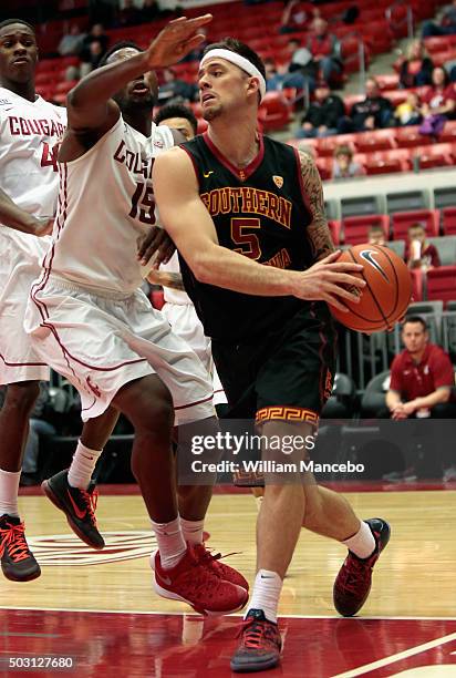 Katin Reinhardt of the USC Trojans controls the ball against Junior Longrus of the Washington State Cougars in the second half of the game at Beasley...