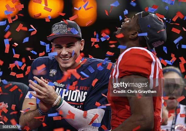 Quarterback Chad Kelly and Laquon Treadwell of the Mississippi Rebels celebrate during the trophy ceremony after their 48-20 win over the Oklahoma...