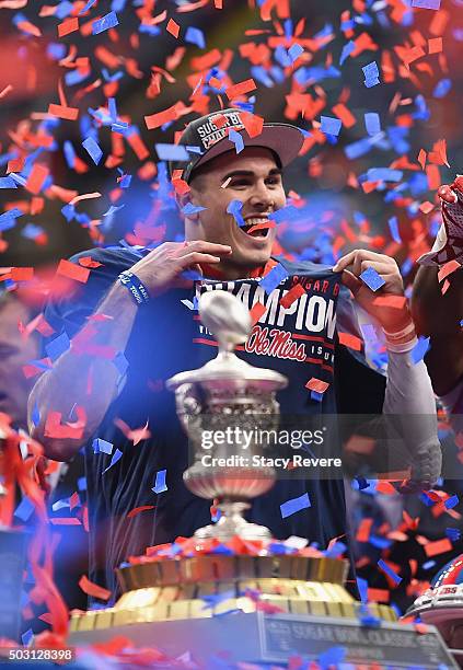 Quarterback Chad Kelly of the Mississippi Rebels celebrates their 48-20 win over the Oklahoma State Cowboys during the trophy presentation after the...