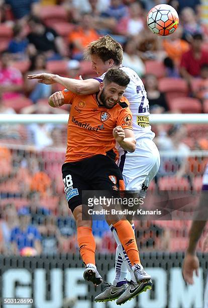 Brandon Borrello of the Roar and Michael Thwaite of the Glory challenge for the ball during the round 13 A-League match between the Brisbane Roar and...
