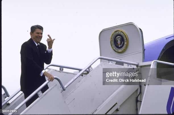 Pres. Ronald W. Reagan boarding airplane with presidential seal on door after GOP Fundraiser for Sen. Cand. Rep. James T. Broyhill.